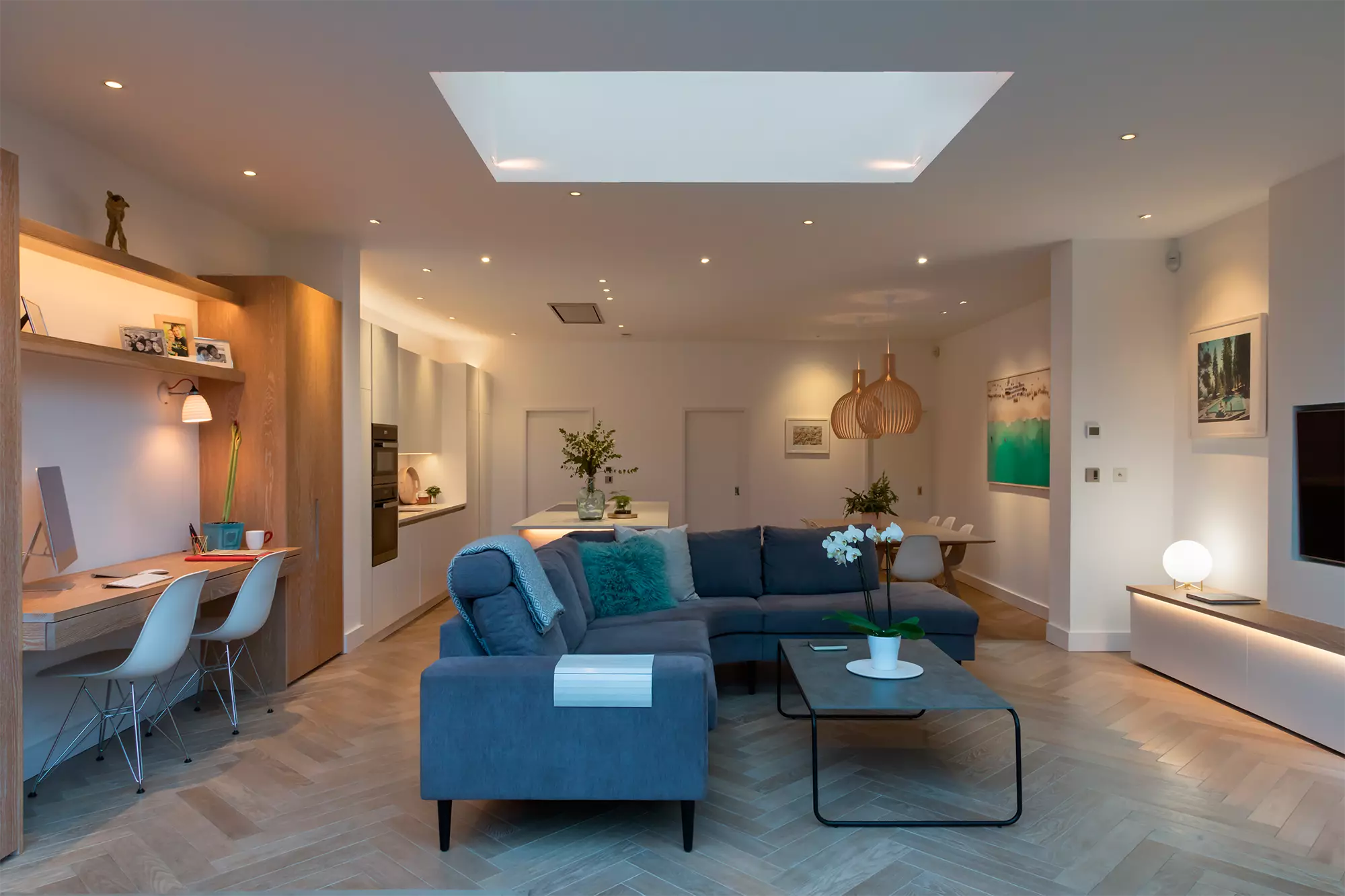 A modern well lit living room featuring multiple lighting sources including recessed ceiling lights a large skylight - 50+ Inspiring Living Room Lighting Ideas for July 2025 - Vorlane