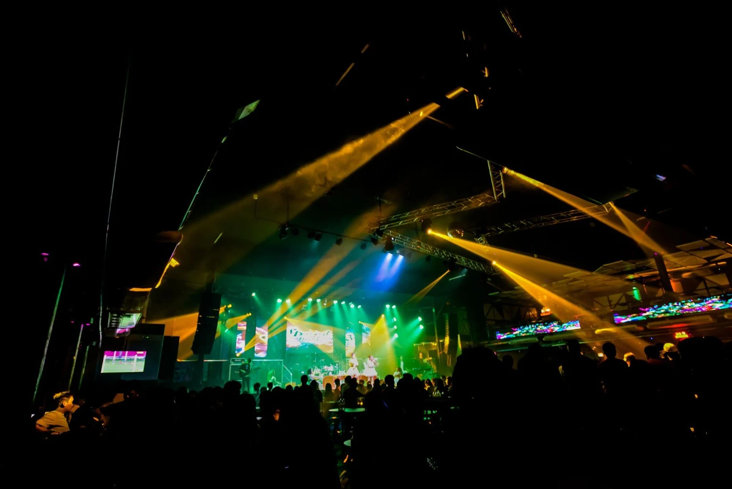A vibrant concert scene featuring dazzling lights and an enthusiastic audience immersed in the performance - Best Concert Stage Set Designs That Will Blow Your Mind - Vorlane - Vorlane