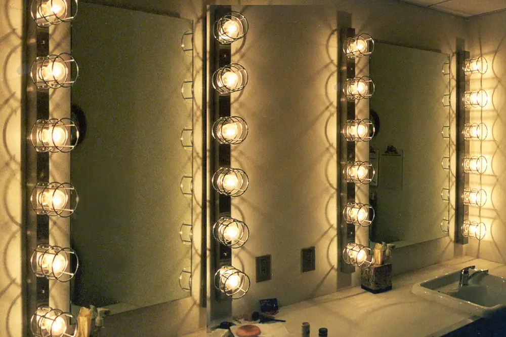 A well lit bathroom with mirrors on the wall showcasing dressing room light fixtures - How to Choose Dressing Room Light Fixtures? - Vorlane - Vorlane
